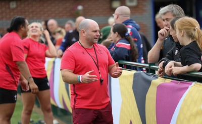 180825 - Wales Women Training Session - Sean Lynn, Wales Women head coach talks with rugby fans during a Wales Women training session ahead of their first Women’s Rugby World Cup match against Scotland