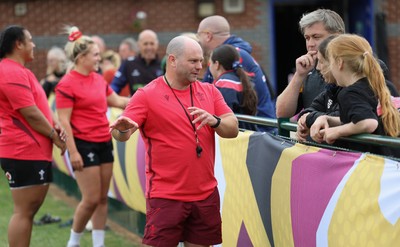 180825 - Wales Women Training Session - Sean Lynn, Wales Women head coach talks with rugby fans during a Wales Women training session ahead of their first Women’s Rugby World Cup match against Scotland
