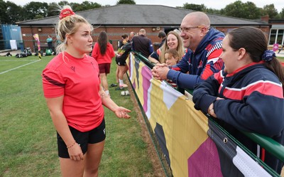 180825 - Wales Women Training Session - Wales’  Alex Callendar with rugby fans who watched the Wales Women training session ahead of their first Women’s Rugby World Cup match against Scotland