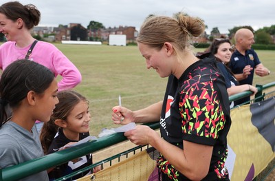 180825 - Wales Women Training Session - Wales’  Carys Cox with rugby fans who watched the Wales Women training session ahead of their first Women’s Rugby World Cup match against Scotland