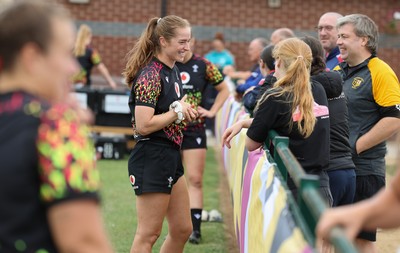 180825 - Wales Women Training Session - Lisa Neumann talks with rugby fans during a Wales Women training session ahead of their first Women’s Rugby World Cup match against Scotland