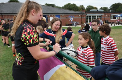 180825 - Wales Women Training Session - Wales’  Alaw Pyrs with rugby fans who watched the Wales Women training session ahead of their first Women’s Rugby World Cup match against Scotland