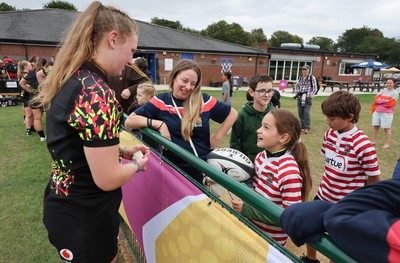 180825 - Wales Women Training Session - Wales’  Alaw Pyrs with rugby fans who watched the Wales Women training session ahead of their first Women’s Rugby World Cup match against Scotland
