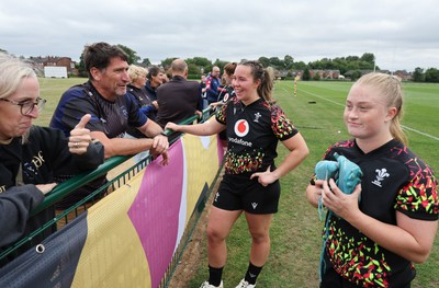 180825 - Wales Women Training Session - Wales’  Katherine Baverstock and Seren Lockwood with rugby fans who watched the Wales Women training session ahead of their first Women’s Rugby World Cup match against Scotland