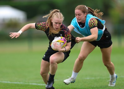 180825 - Wales Women Training Session - Cath Richards is held by Lisa Neumann during a Wales Women training session ahead of their first Women’s Rugby World Cup match against Scotland