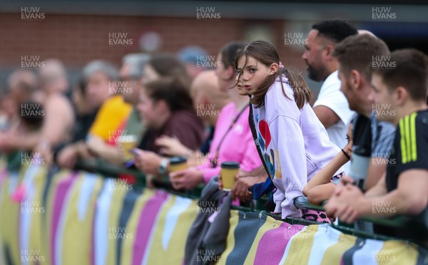 180825 - Wales Women Training Session - Rugby supporters watch during a Wales Women training session ahead of their first Women’s Rugby World Cup match against Scotland