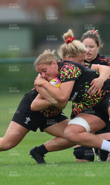 180825 - Wales Women Training Session - Tilly Vucaj is tackled by  Molly Reardon during a Wales Women training session ahead of their first Women’s Rugby World Cup match against Scotland