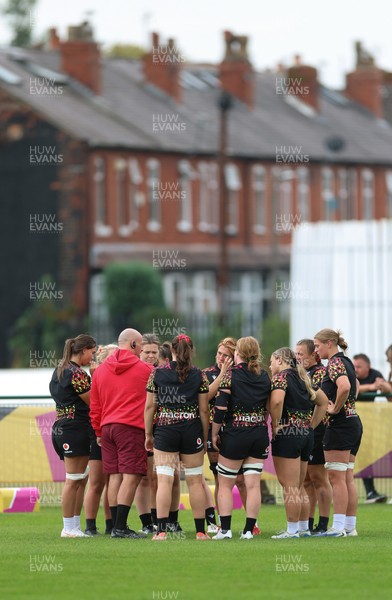 180825 - Wales Women Training Session - The team huddle up during a Wales Women training session ahead of their first Women’s Rugby World Cup match against Scotland