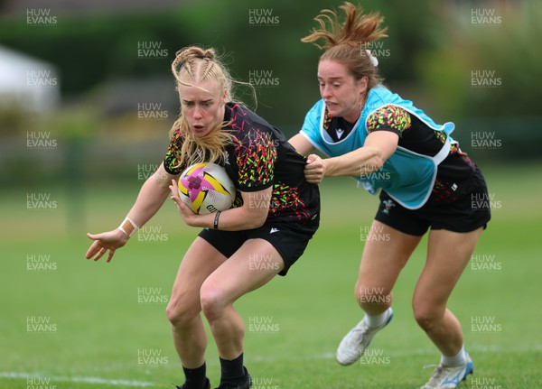 180825 - Wales Women Training Session - Cath Richards is held by Lisa Neumann during a Wales Women training session ahead of their first Women’s Rugby World Cup match against Scotland
