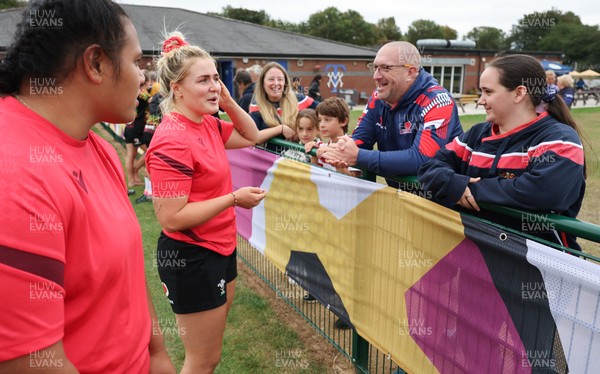 180825 - Wales Women Training Session - Wales’  Sisilia Tuipulotu and Alex Callendar with rugby fans who watched the Wales Women training session ahead of their first Women’s Rugby World Cup match against Scotland