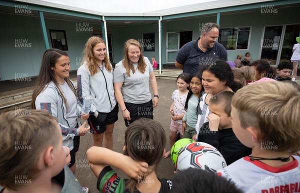 281022 - Wales Women Rugby School Engagement Event at Kamo Primary School - Wales team members Kayleigh Powell, Niamh Terry and Caryl Thomas meet pupils at Kamo Primary School in Whangarei during a visit to take part in rugby activities