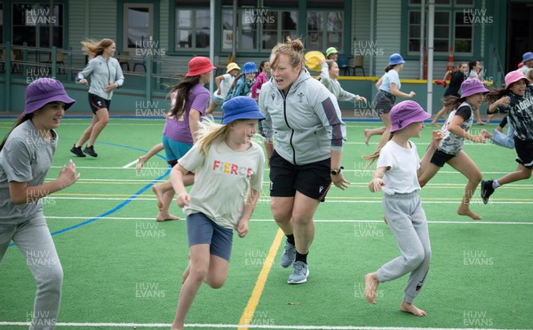281022 - Wales Women Rugby School Engagement Event at Kamo Primary School - Wales’ Caryl Thomas takes part in a rugby coaching session with children at Kamo Primary School in Whangarei during a visit to the school