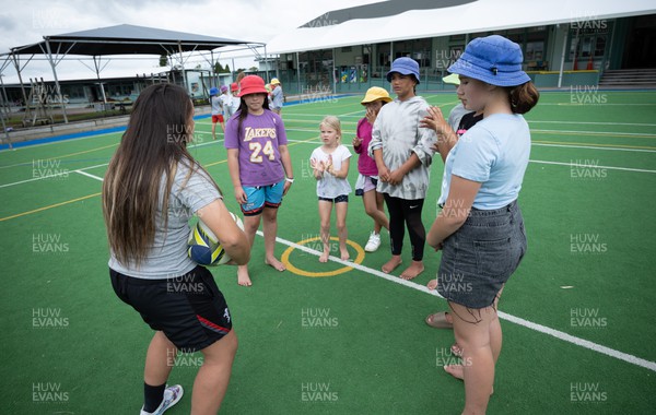 281022 - Wales Women Rugby School Engagement Event at Kamo Primary School - Wales’ Kayleigh Powell takes part in a riugby coaching session with children at Kamo Primary School in Whangarei during a visit to the school