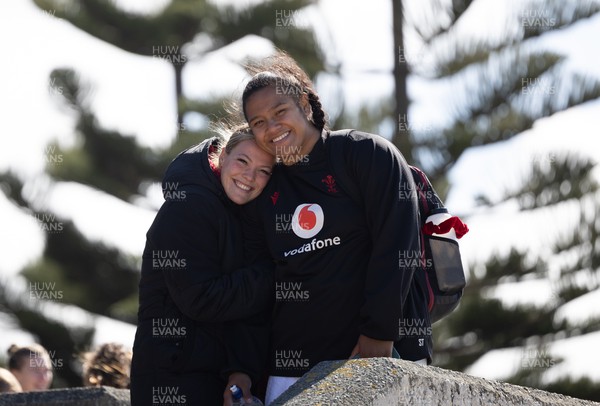 191023 - Wales Women Rugby Sea Recovery - Wales Women rugby players take a sea recovery session in Oriental Bay, Wellington after training ahead of Wales’ opening match of WXV1 against Canada Kelsey Jones and Sisilia Tuipulotu wrap up warm at the end of the session