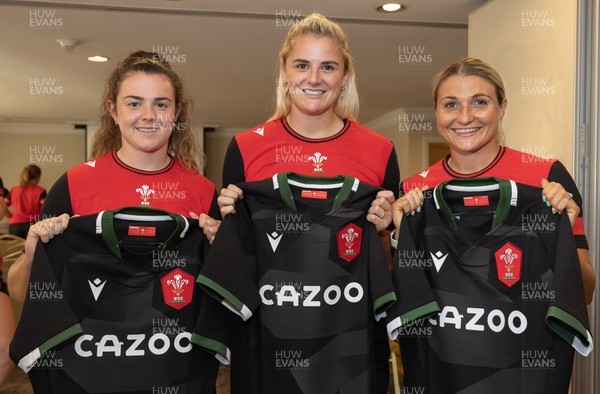 260822 - Wales Women Shirt Presentation - Wales’ Eloise Hayward, Carys Williams-Morris and Lowri Norkett with their match shirts ahead of the game against Canada
