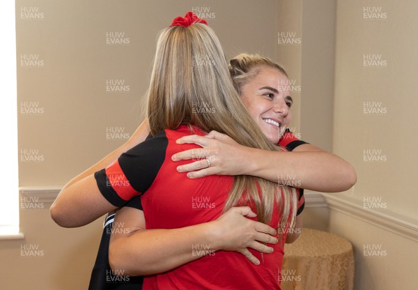 260822 - Wales Women Shirt Presentation - Carys Williams-Morris is presented with her match shirt by Hannah Jones ahead of the game against Canada