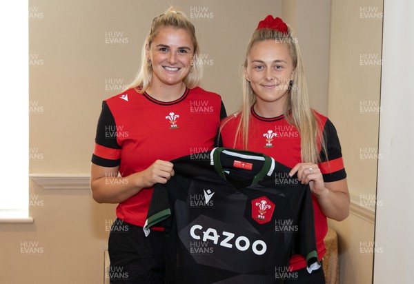 260822 - Wales Women Shirt Presentation - Carys Williams-Morris of Wales is presented with her match shirt by Hannah Jones ahead of the game against Canada