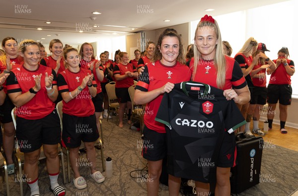 260822 - Wales Women Shirt Presentation - Eloise Hayward is presented with her match shirt by Hannah Jones ahead of the game against Canada