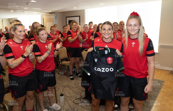 260822 - Wales Women Shirt Presentation - Lowri Norkett is presented with her match shirt by Hannah Jones ahead of the game against Canada