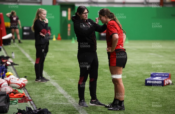 120324 - Wales Women skills session - Bryonie King is assisted by Dr Gwennan Williams during a skills session ahead of the start of the Women’s 6 Nations