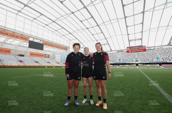 261023 - Wales’ Women Stadium Orientation and Kickers Session - Wales kickers, left to right, Lleucu George, Keira Bevan and Robyn Wilkins after their kicking session at the Forsyth Barr Stadium in Dunedin where they will play New Zealand in WCV1 on Saturday
