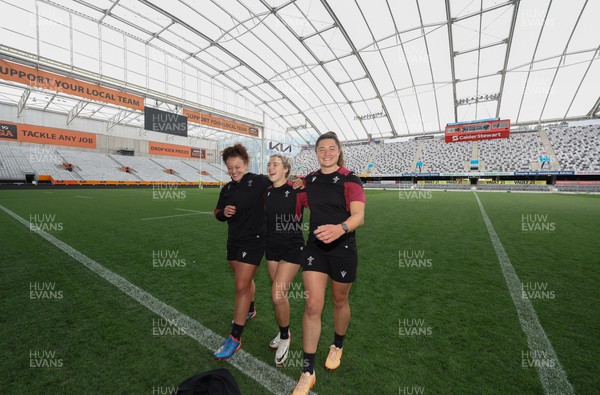 261023 - Wales’ Women Stadium Orientation and Kickers Session - Wales kickers, left to right, Lleucu George, Keira Bevan and Robyn Wilkins after their kicking session at the Forsyth Barr Stadium in Dunedin where they will play New Zealand in WCV1 on Saturday