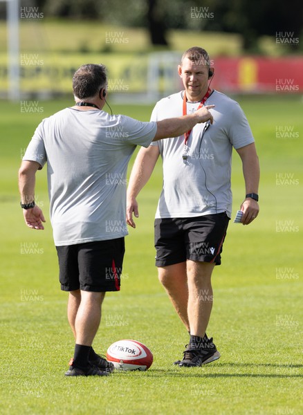 010923 - Wales Women Rugby training session - Ioan Cunningham chats with Shaun Connor during a training session in the build up to the WXV matches in New Zealand