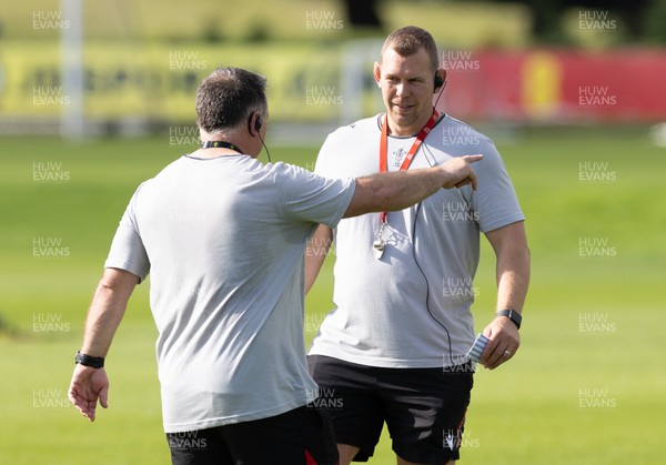 010923 - Wales Women Rugby training session - Ioan Cunningham chats with Shaun Connor during a training session in the build up to the WXV matches in New Zealand