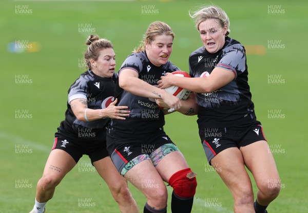 010923 - Wales Women Rugby training session - Bethan Lewis with Keira Bevan, left and Alex Callender during a training session in the build up to the WXV matches in New Zealand