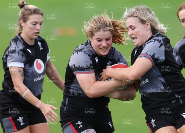 010923 - Wales Women Rugby training session - Bethan Lewis with Keira Bevan, left and Alex Callender during a training session in the build up to the WXV matches in New Zealand