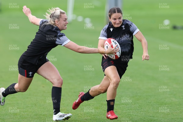 010923 - Wales Women Rugby training session - Jazz Joyce gets past Hannah Jones during a training session in the build up to the WXV matches in New Zealand