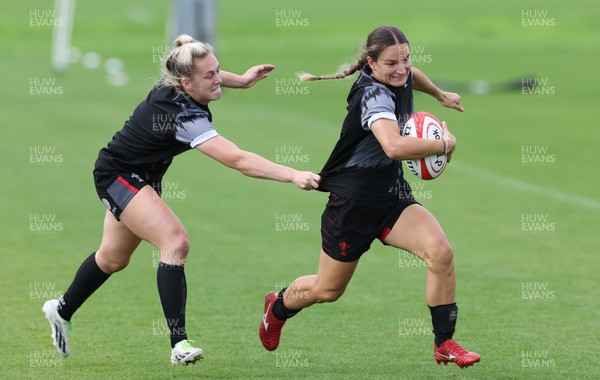 010923 - Wales Women Rugby training session - Jazz Joyce gets past Hannah Jones during a training session in the build up to the WXV matches in New Zealand