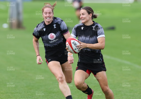 010923 - Wales Women Rugby training session - Jazz Joyce gets away from Lisa Neumann during a training session in the build up to the WXV matches in New Zealand