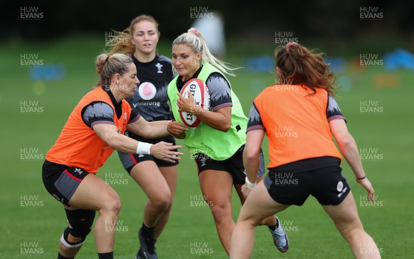 010923 - Wales Women Rugby training session - Lowri Norkett takes on Kerin Lake during a training session in the build up to the WXV matches in New Zealand