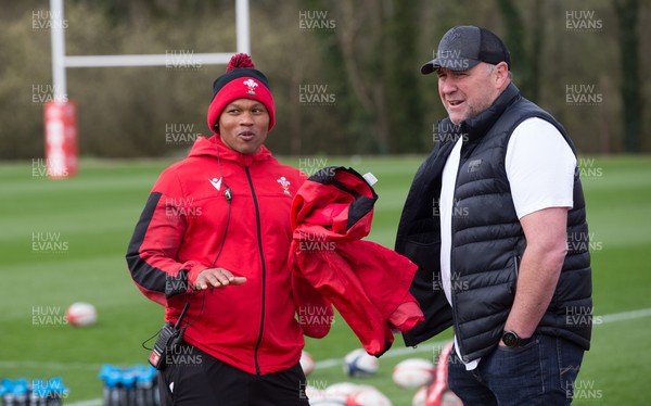 010421 - Wales Women Rugby Squad Training session - Wales Women's head coach Warren Abrahams, left, chats with with Wales mens head coach Wayne Pivac after the women's training session ahead of the start of the Women's Six Nations
