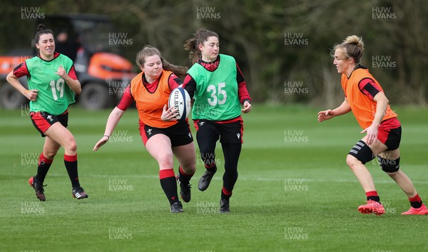 010421 - Wales Women Rugby Squad Training session - Left to right, Jess Roberts, Gwenllian Jenkins, Robyn Wilkins and Bethan Dainton of Wales during training session ahead of the start of the Women's Six Nations