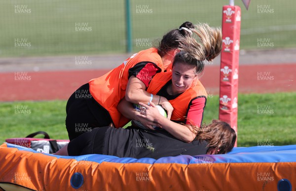 210922 - Wales Women RWC Training Session - Elinor Snowsill is tackled during a training session ahead of departure to New Zealand for the Rugby World Cup