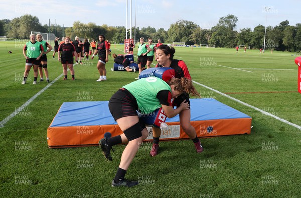 210922 - Wales Women RWC Training Session - Sioned Harries is tackled by Natalia John during a training session ahead of departure to New Zealand for the Rugby World Cup