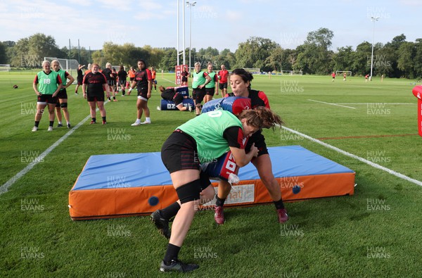 210922 - Wales Women RWC Training Session - Sioned Harries is tackled by Natalia John during a training session ahead of departure to New Zealand for the Rugby World Cup