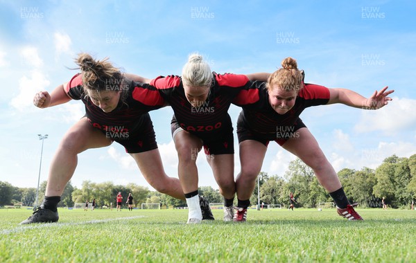 210922 - Wales Women RWC Training Session - Cerys Hale, Kelsey Jones and Cara Hope during a training session ahead of departure to New Zealand for the Rugby World Cup