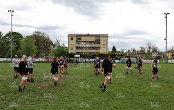 250423 - Wales Women Rugby Training Session - The Wales Women’s team warm up for a training session at Parma Rugby Club ahead of the TicTok Women’s 6 Nations match against Italy