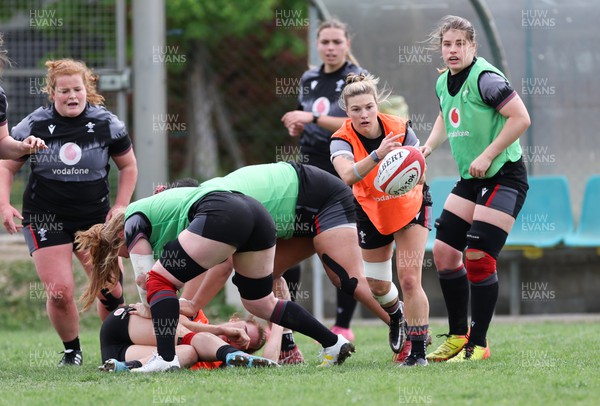 250423 - Wales Women Rugby Training Session - Keira Bevan of Wales feeds the ball out during a training session at Parma Rugby Club ahead of the TicTok Women’s 6 Nations match against Italy