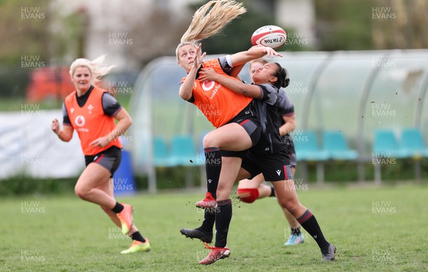 250423 - Wales Women Rugby Training Session - Hannah Jones and Jenna De Vera compete for the ball during a training session at Parma Rugby Club ahead of the TicTok Women’s 6 Nations match against Italy