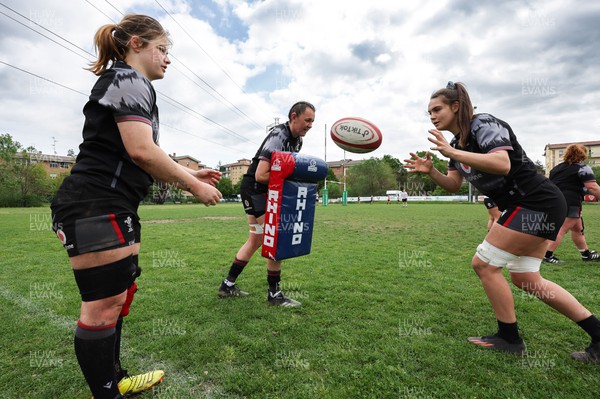 250423 - Wales Women Rugby Training Session - Bethan Lewis, left, Charlie Munday, centre and Bryonie King during a training session at Parma Rugby Club ahead of the TicTok Women’s 6 Nations match against Italy