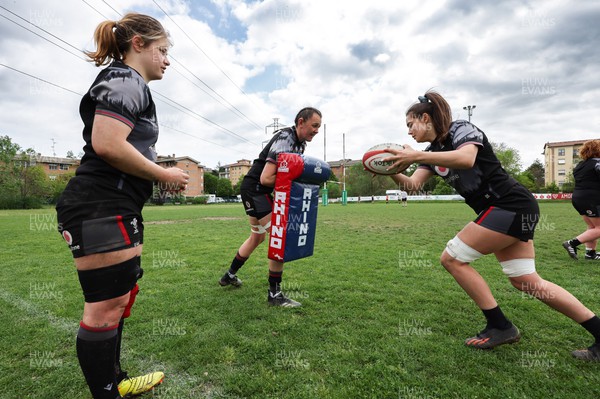 250423 - Wales Women Rugby Training Session - Bethan Lewis, left, Charlie Munday, centre and Bryonie King during a training session at Parma Rugby Club ahead of the TicTok Women’s 6 Nations match against Italy