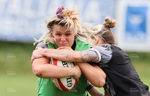 250423 - Wales Women Rugby Training Session - Alex Callender takes on Keira Bevan during a training session at Parma Rugby Club ahead of the TicTok Women’s 6 Nations match against Italy