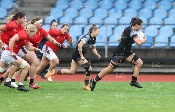 300922 - Wales Women Rugby Training Session - Wales’ Sioned Harries breaks away  during a combined training session with USA  ahead of the start of the Women’s Rugby World Cup