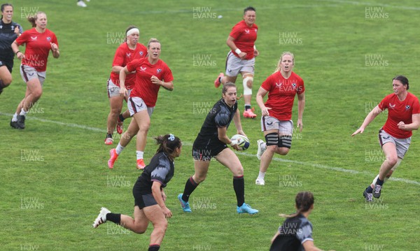 300922 - Wales Women Rugby Training Session - Wales’ Lisa Neumann feeds the ball out during a combined training session with USA ahead of the start of the Women’s Rugby World Cup