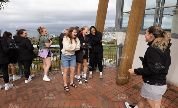 131023 - Wales squad members Abbie Fleming, Kate Williams, Carys Cox and Sisilia Tuipulotu pose for photographs overlooking Wellington after taking a tram ride as they get some down time after their first training session in New Zealand 