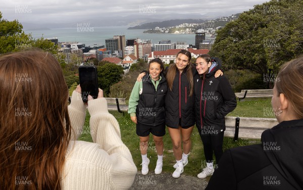 131023 - Wales squad members Megan Davies, Bryonie King and Nel Metcalfe pose for photographs overlooking Wellington after taking a tram ride as they get some down time after their first training session in New Zealand 